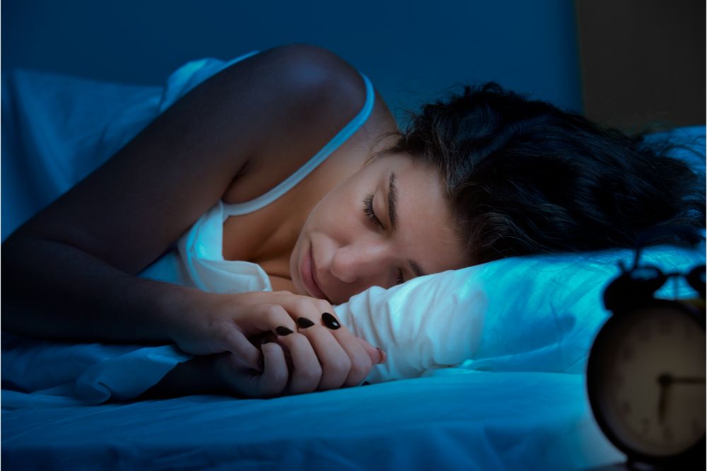 Woman Sleeping with alarm clock
