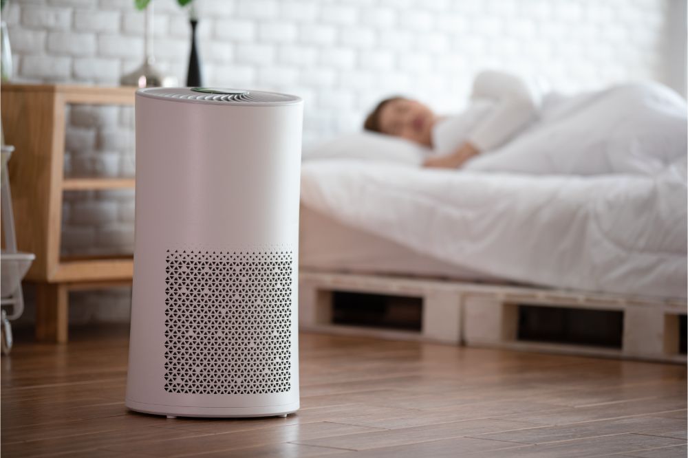 woman sleep with Air purifier in cozy white bed room
